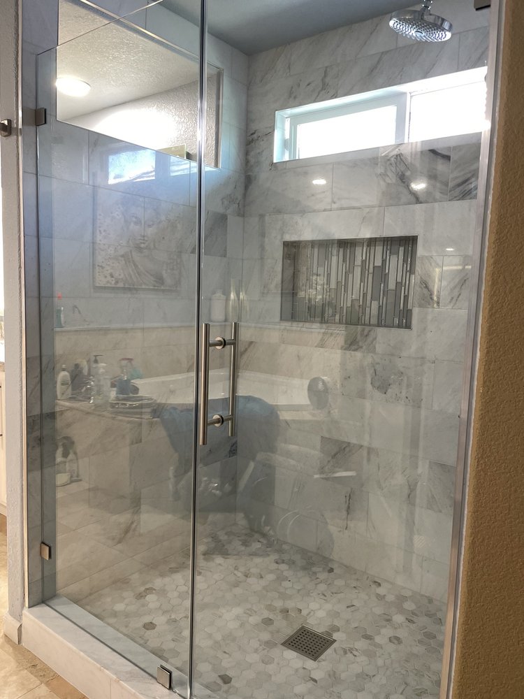 Close-up of white subway tile installation in a walk-in shower remodel, Roseville CA tile contractor.